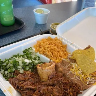 a plate of pulled pork and rice