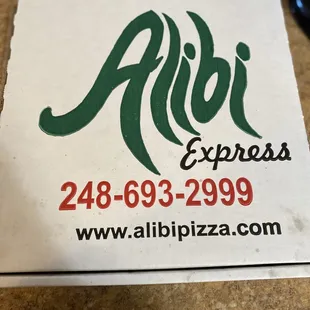 a pizza box on a counter