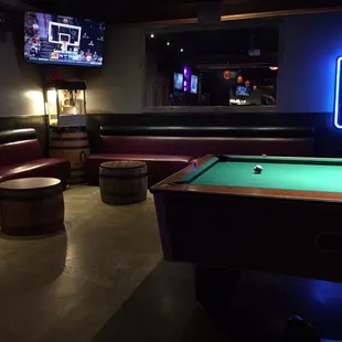 Comfy seats, pool table, sporty TV, and music box.