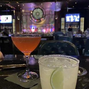 two cocktails on a bar