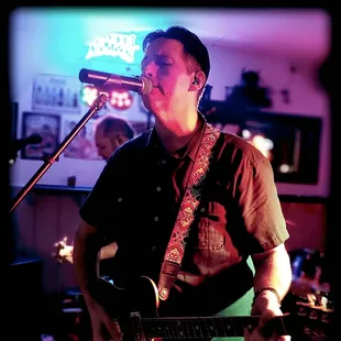 a man singing into a microphone