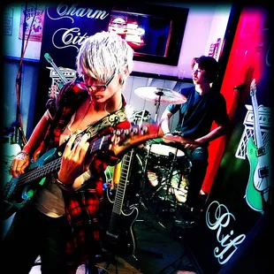 a woman playing a guitar