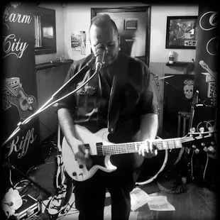 a man playing a guitar