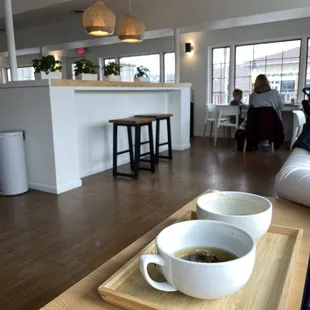 two cups of coffee on a tray