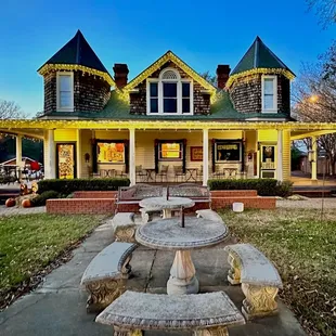 a picnic table in front of a house