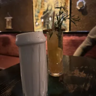a pitcher and a glass on a table