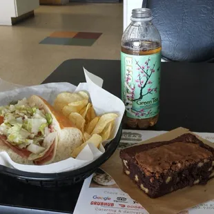 Italian sub, chips, pickle, brownie, &amp; bottled tea.