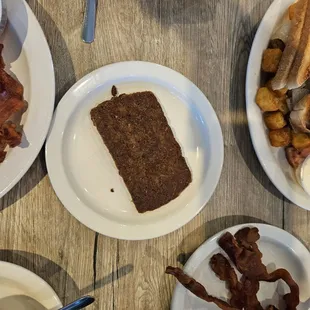 Side of scrapple. It's Rappa, it's real... Side of bacon  next to it ..