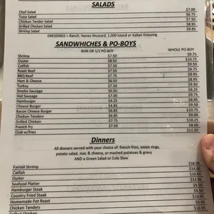 a hand holding a menu