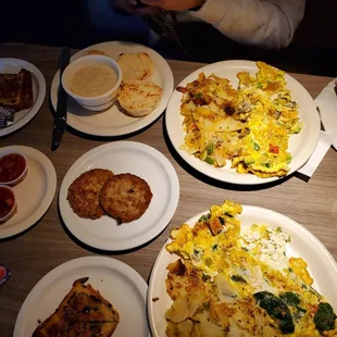 Mediterranean omelet, veggie omelet, turkey sausage, coffee, salsa, SOS, and raisin bread.