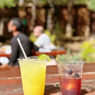 two drinks on a picnic table