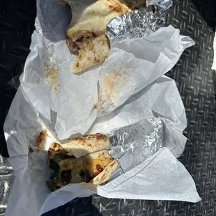 a half eaten burrito