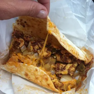 The "Michael": egg, chorizo, cheese, chiles, &amp; onion on homemade tortilla @ $3.99 (not actual size - first couple bites missing)