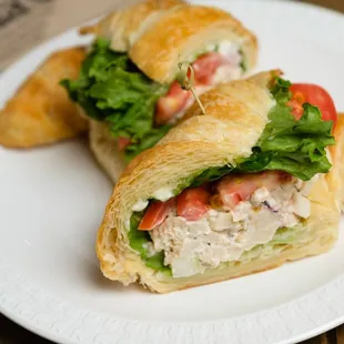 Cranberry-Almond Chicken Salad with lettuce, tomatoes &amp; mayonnaise on a butter croissant.