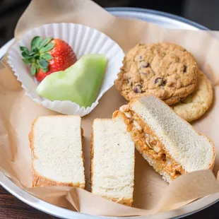 The Little Monkey Plate: peanut butter, honey, &amp; bananas on a crustless potato bread served with fruit, cookies &amp; a small drink.
