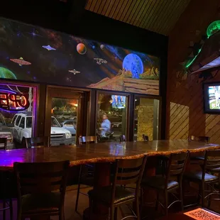 a bar with neon signs