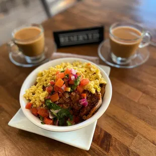 a bowl of food and a cup of coffee