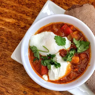 a bowl of chili and eggs