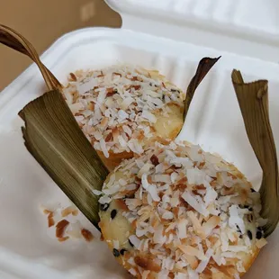 a half eaten food item in a styrofoam container