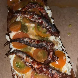 ricotta, garlic, spicy anchovies, cherry tomato and chili oil crostini- really delicious combination of textures and flavors