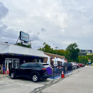 a car parked in front of the restaurant