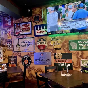 a wall full of beer signs