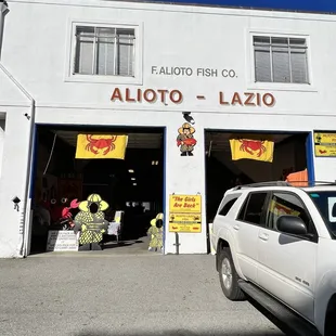 a car parked in front of the shop