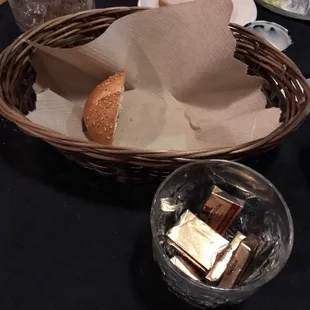 a basket of bread and a bottle of ketchup