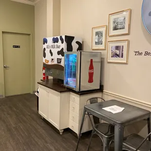 a kitchen with a table and chairs