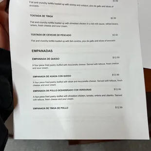 a person holding a menu
