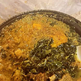 Curry goat, pumpkin channa spinach buss up