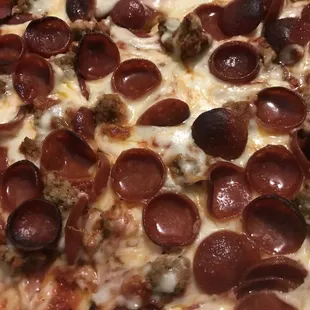 Close up of the 12 cut (square) pizza. I asked for brown to black little burn on the pep and they nailed my request. This is great pizza.