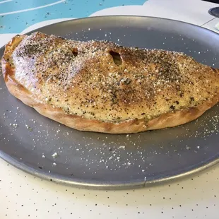 a piece of pizza on a plate