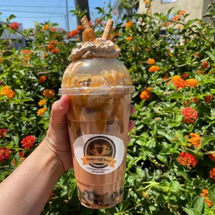 Iced Raspberry white mocha with Carmel drizzle and coffee boba