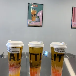 three cups of coffee on a table