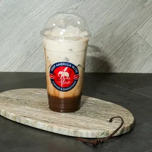 a cold drink on a wooden board