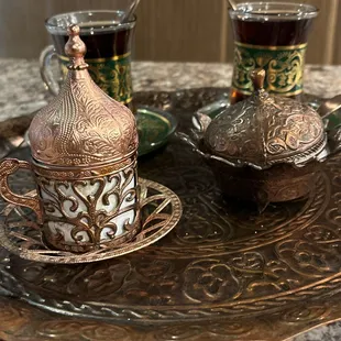 two cups of tea on a tray