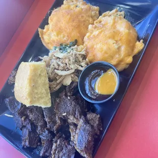 Brisket dinner * loaded mac n cheese, cornbread, side of slaw underneath, some extra dipping BBQ sauce and scrumptious beef brisket!