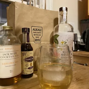 a glass of alcohol and a bottle of liquor