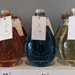 four bottles of liquor on a shelf