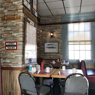 a dining area with tables and chairs