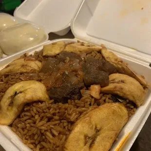 Jollof Rice With Plantain and Protein (goat and cow skin)