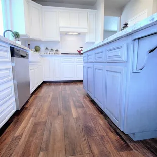  a kitchen with hardwood floors