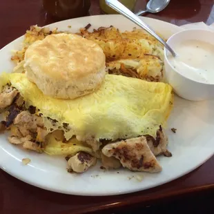 Chicken fajita omelette, hash browns, biscuit and gravy.
