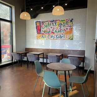 tables, chairs, and artwork