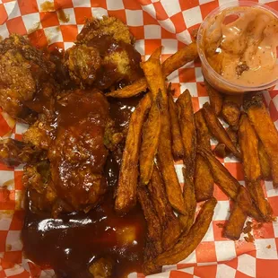 Tenders with bbq sauce, sweet potato fries and Cane&apos;s dipping sauce