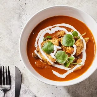 a bowl of soup with croutons