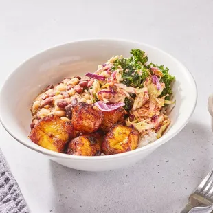 a bowl of food and a fork