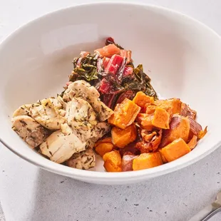 a bowl of food and a fork