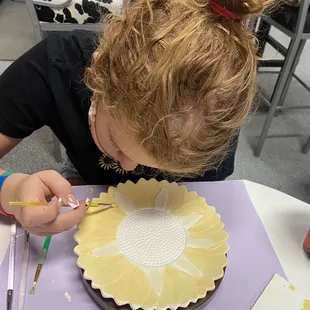 My daughter working on her masterpiece after getting some pointers from Gail.